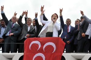Former Turkish Interior minister and lawmaker of Turkey's right-wing Nationalist Movement Party (MHP) Meral Aksener (C) speaks to supporters as riot police sealed off a hotel to prevent thousands of MHP dissidents from holding a party congress in Ankara, on May 15, 2016. Members of the MHP party were prevented from holding a congress on May 15 aimed at unseating longtime leader Devlet Bahceli and recovering ground lost to President Recep Tayyip Erdogan's party. Dissidents from the Nationalist Movement Party launched a campaign to oust Bahceli after a general election in November in which the party shed half its support -- taking just 40 seats in the 550-member parliament compared to 80 five months previously. / AFP / ADEM ALTAN (Photo credit should read ADEM ALTAN/AFP/Getty Images)